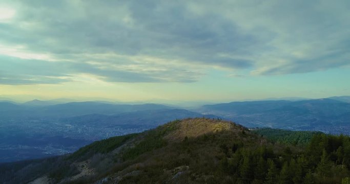 Sarajevo view from mountain over hill with blue and yellow sky