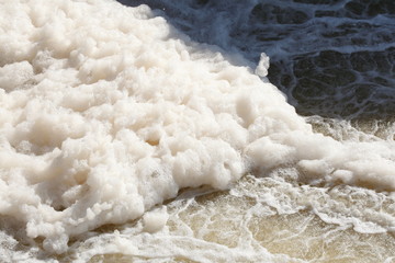 Fototapeta na wymiar Foaming water in a river, Germany, Europe