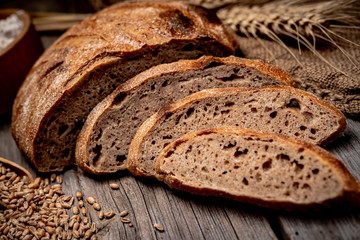 Freshly baked traditional bread on wooden table