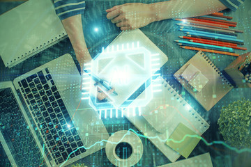 Double exposure of hands making notes with digital coding icons. Computer learning concept.