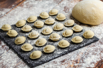 raw dumplings khinkali ravioli in flour
