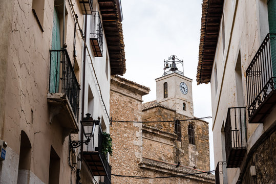 View of the streets of the medieval town of Pastrana with the church clock tower