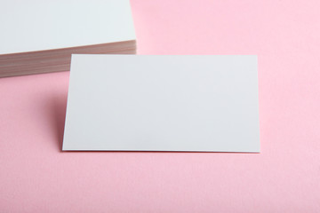 business cards on a colored background top view. Place to insert text