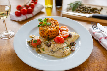 Dorada filet with sweet potato, olive and caper dressing