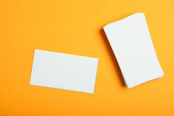 business cards on a colored background top view. Place to insert text