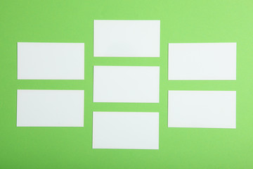 business cards on a colored background top view. Place to insert text