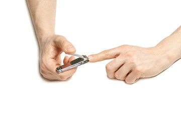 Man do manicure at home. Self hand routine. Copy space for text. Male finger procedure. White background isolated. Copyspace. Thumb fingernail clean. Man manicurist service