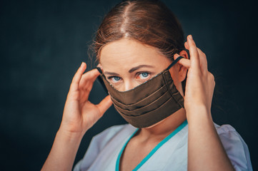 Close up woman portrait, Young woman wearing home made hygienic face medical mask to prevent...