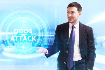 Business, Technology, Internet and network concept. Young businessman working on a virtual screen of the future and sees the inscription: Ddos attack