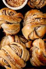 Close up of traditional Swedish cardamom sweet buns Kanelbulle. Flat lay, food background