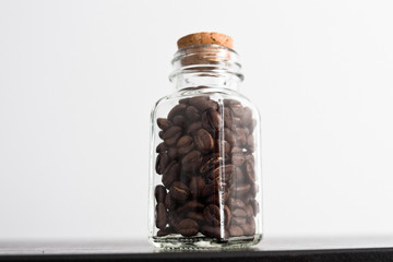 Coffee beans in a transparent jar