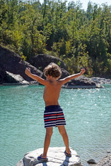  Europe, Italy , Piacenza, Bobbio - children five years old enjoy the nature in the river - summer and holidays during the n-cov19 Coronavirus epidemic        