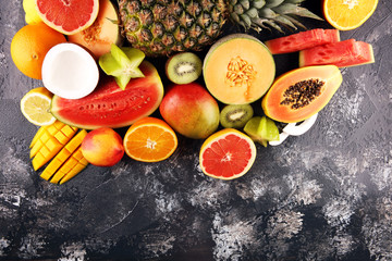 Tropical fruits background, many colorful ripe fresh tropical exotic fruits