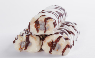 delicious white cake marshmallow sticks with condensed milk on a white background