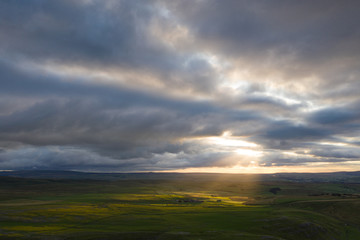 Sunrays dance across above Gordale Scar, Malham, in the Yorkshire Dales National Park