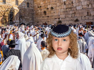 Jewish blond boy on the blessing of the Cohen