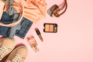 Woman flat lay background with cloth, accerrories and cosmetics.