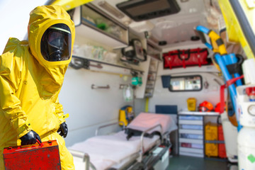  Ambulance and equipment views from inside and man  in yellow protective hazmat suit.  Epidemic...