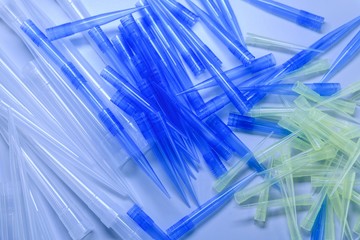Closeup shot of many laboratory pipette tips used for coronavirus research