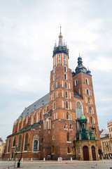 Fototapeta na wymiar St. Mary's basilica in main square of Krakow. Poland's historic center, a city with ancient architecture. Cracow, Poland. Quarantine in the city.