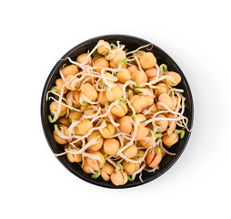 Peas sprouted in a separate black cup on a white background. Top view.