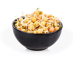 Peas sprouted in a separate black cup on a white background.