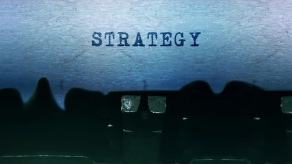 Strategy Word closeup Being Typing and Centered on a Sheet of paper on old vintage Typewriter mechanical 4k Footage Background Animation. - Powered by Adobe