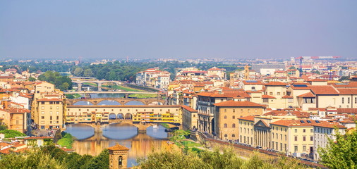 Obraz premium Top view of beautiful city of Florence - river, promenades and bridges