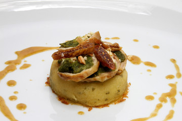 Rabbit saddle stuffed with dried figs, chard and celline olives with almond brittle