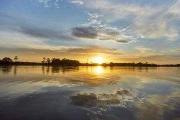 Naklejka premium sunset over the Amazonas river 