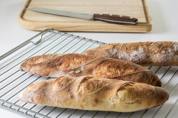 fresh french baguette on a white table