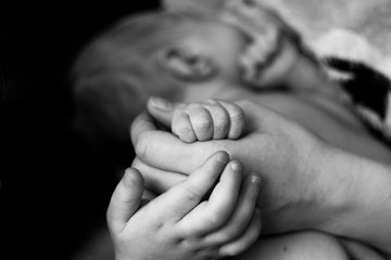 baby in mothers hands