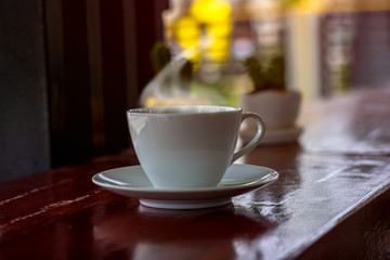 A cup of black coffee or americano with roasted coffee bean in bag, good coffee for health is black coffee without sugar and milk
