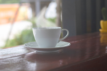 A cup of black coffee or americano with roasted coffee bean in bag, good coffee for health is black coffee without sugar and milk
