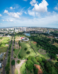 Aerial view of Campo Grande MS, Brazil - Highs of Afonso Pena avenue. Aerial view of a growing city with some buildings and a huge green area. Green city. 