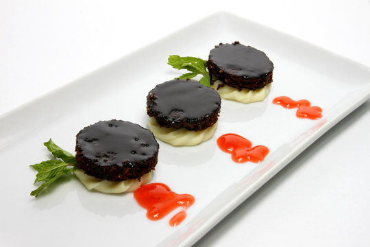 Cocoa mustaccioli with lemon ganache. Typical sweets of the gastronomic tradition of Campania, Italy