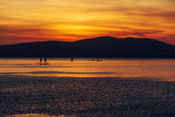 SAP surfing at sunset in Gelendzhik, Krasnodar region.