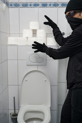 Burglar stealing Toilet paper