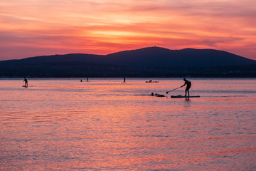 SAP surfing at sunset in Gelendzhik, Krasnodar region.