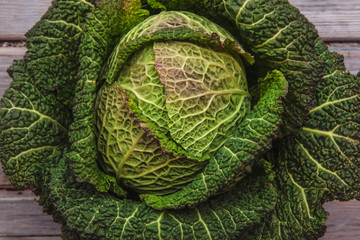 Fresh green cannage head on a rustic wooden background