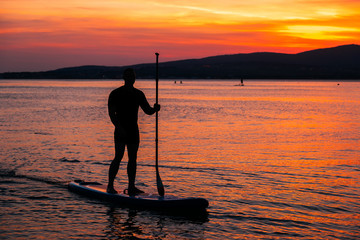 SAP surfing at sunset in Gelendzhik, Krasnodar region.