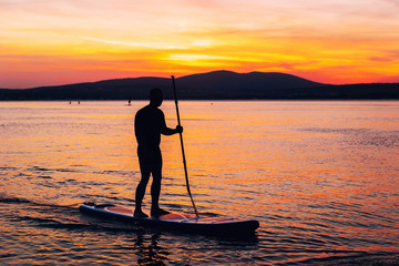 SAP surfing at sunset in Gelendzhik, Krasnodar region.