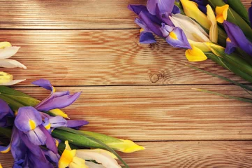 Gordijnen iris flower on white wooden background © Morgan Studio