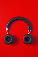 wireless headphones on a red background