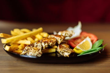 chicken sticks on barbecue