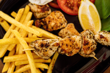 chicken sticks on barbecue