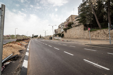 Jerusalem, Israel - Ha-Rav Herzog Street - 27 03 2020: empty streets during Corona Virus quarantine A view of the main road