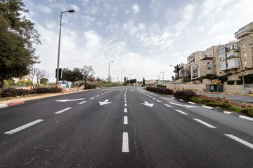 Fototapeta na wymiar Jerusalem, Israel - Ha-Rav Herzog Street - 27 03 2020: empty streets during Corona Virus quarantine A view of the main road