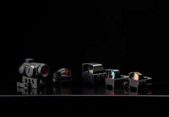 Different modern optical collimator sights on dark back. Sights for rifles, carbines and pistols.