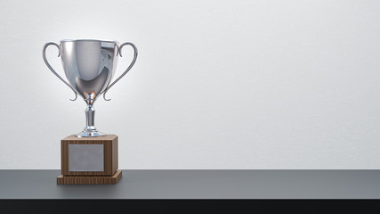 3D rendering. Silver trophy on table background.